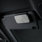 Car visor with a gray visor clip attached, featuring the 'altma' brand.